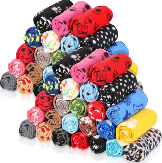 Preboun 50 Pack Puppy Blankets Bulk, 24 x 28 Inch Soft Fleece Pet Paw Print Blankets, Sleep Mat Bed Cover for Kitten, Dogs, Cats & Small Animals, 25 Styles