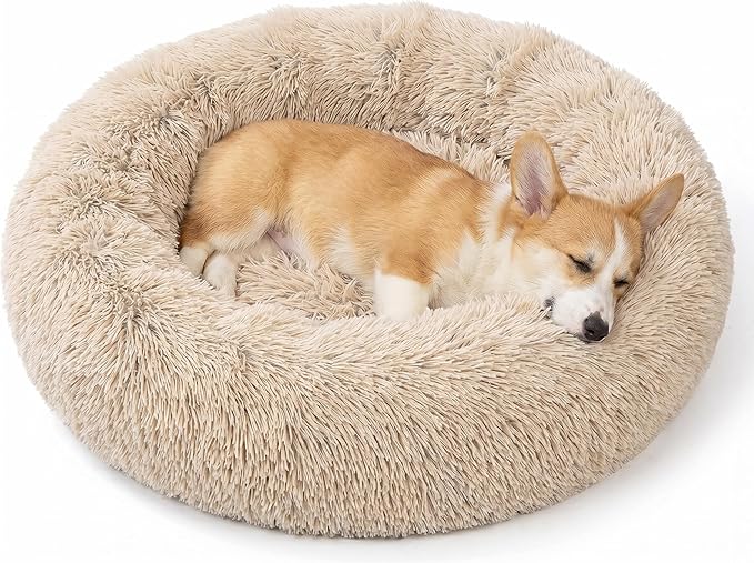 SAVFOX 23 inches Calming Donut Dog Bed - 3X Durable Plush Faux Fur, Machine Washable & Non-Slip, Fits up to 25 lbs, Beige